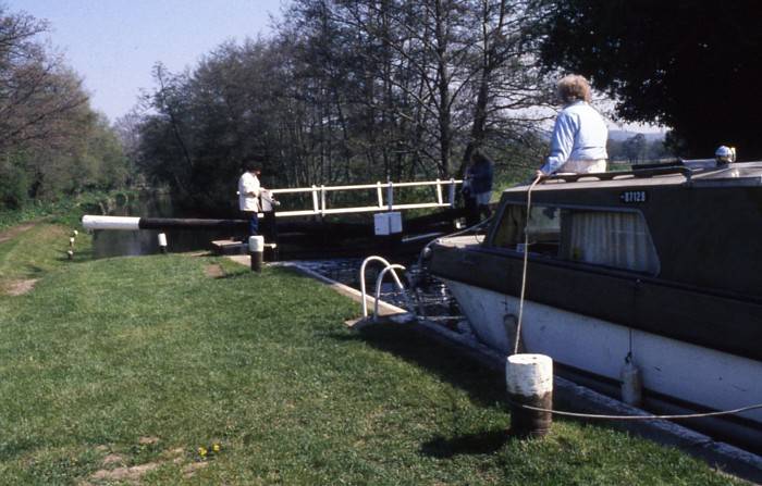 Hold boat in position while bottom gate paddles opened